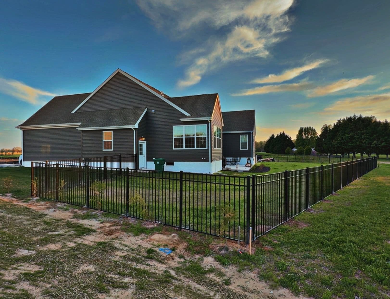 Gallery photos for Black Three-Rail Aluminum Fence Installed Around Beautiful Backyard: Image #1