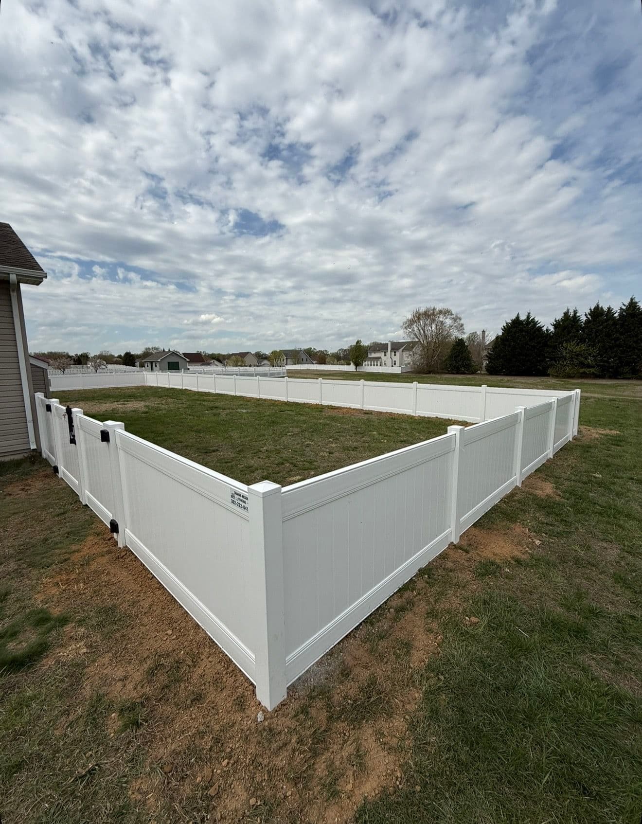 Project 4-Foot White Vinyl Privacy Fence Keeps This Backyard Safe image