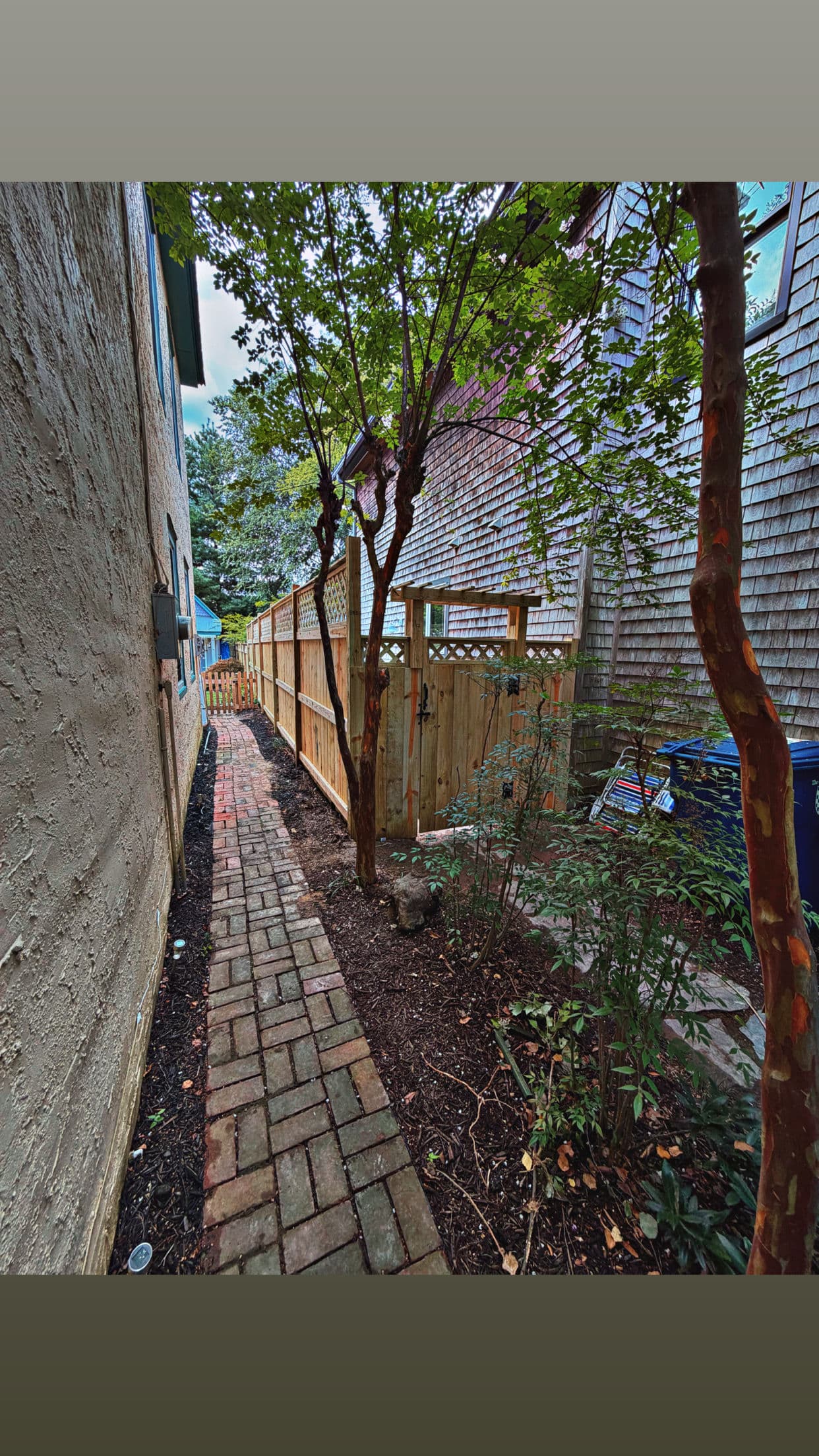 Custom Wood Fence with Lattice Top Fits Right In image