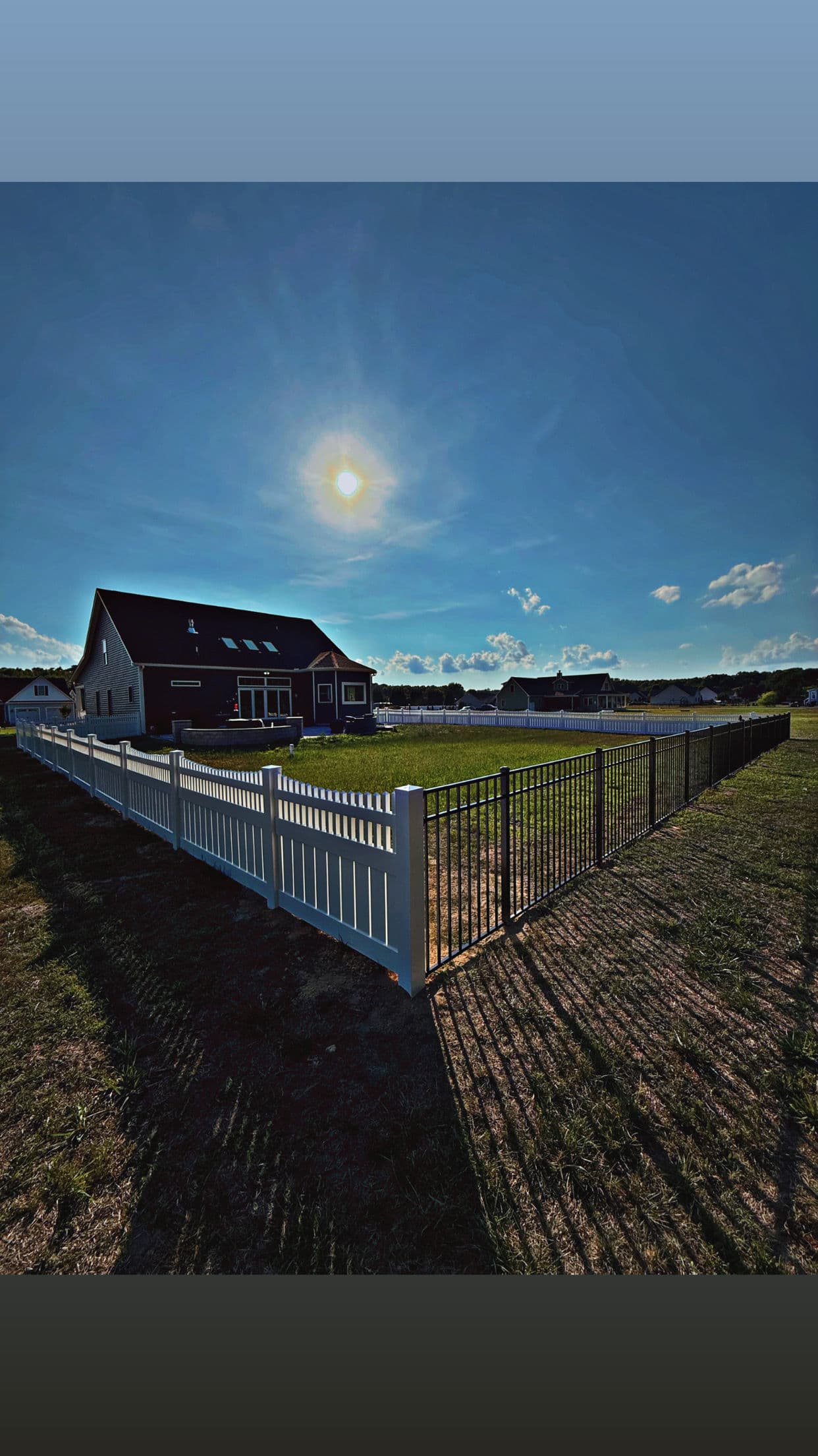 Semi-Privacy Vinyl Fence with 3-Rail Aluminum Flush Bottom Panels image