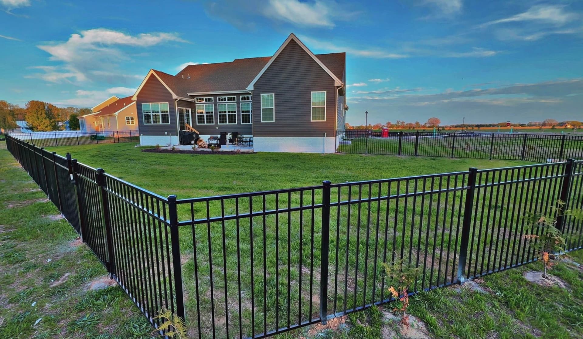 Gallery photos for Black Three-Rail Aluminum Fence Installed Around Beautiful Backyard: Image #3