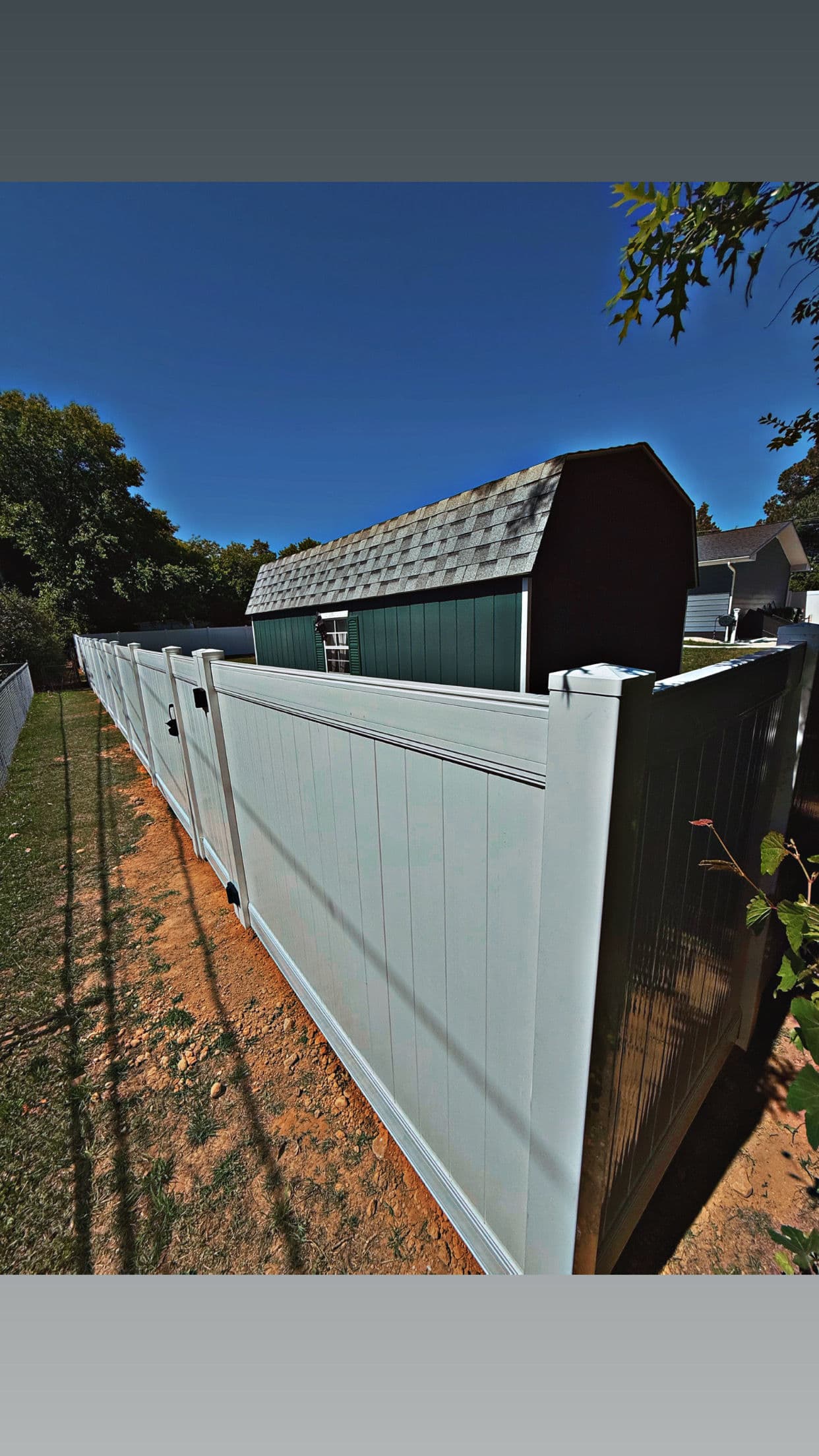 Gallery photos for White Vinyl Privacy Fence With a Custom Height Transition: Image #5